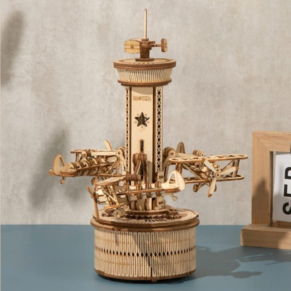 Wooden mechanical model on a table with a neutral background