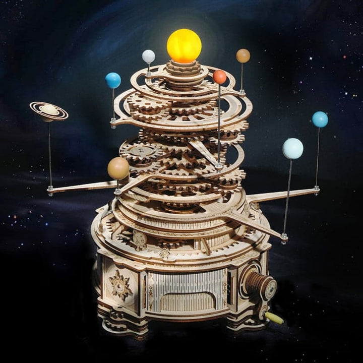 Wooden model of a solar system with planets against a starry space background