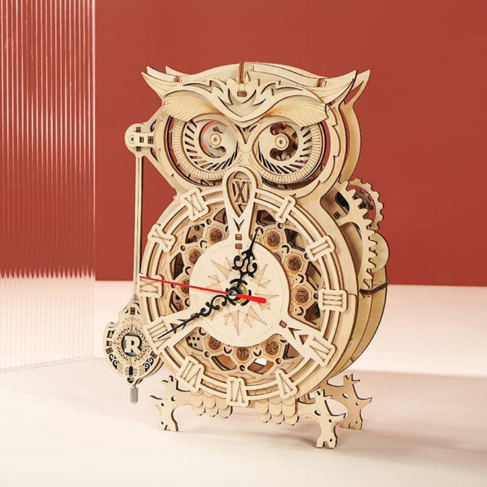 Wooden owl clock with mechanical design on a light background