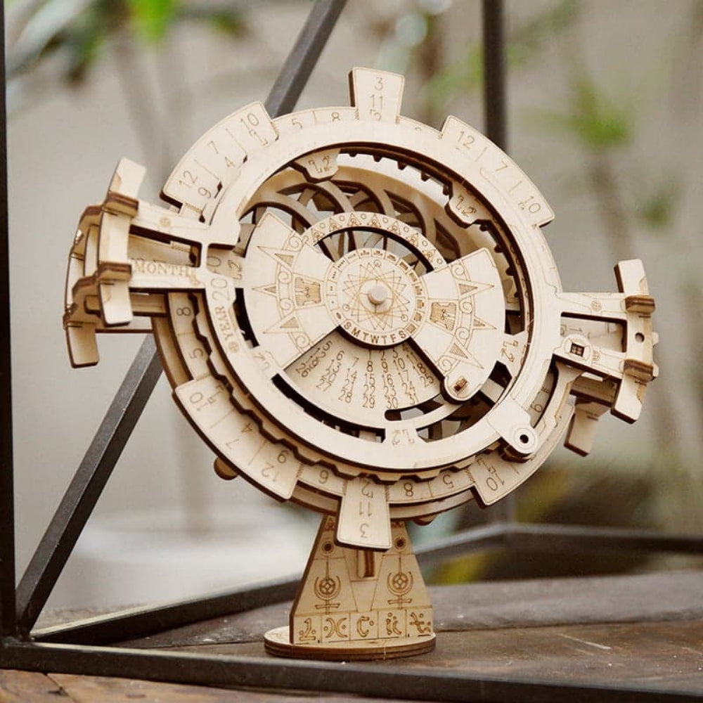 Wooden mechanical model on a stand with a blurred background