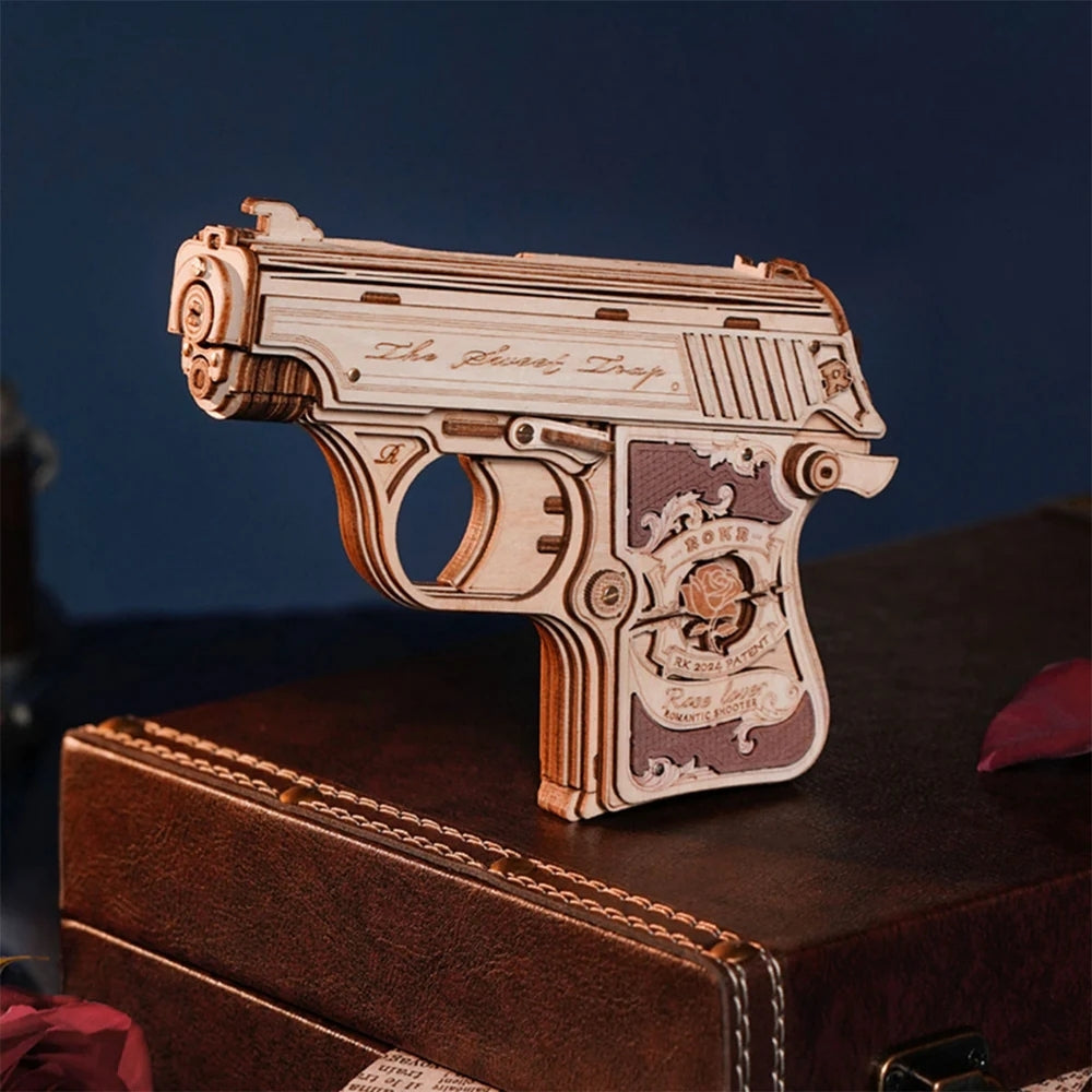 Wooden gun model on a dark surface with a blue background