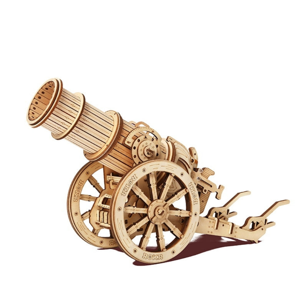 Wooden model of a cannon on a white background