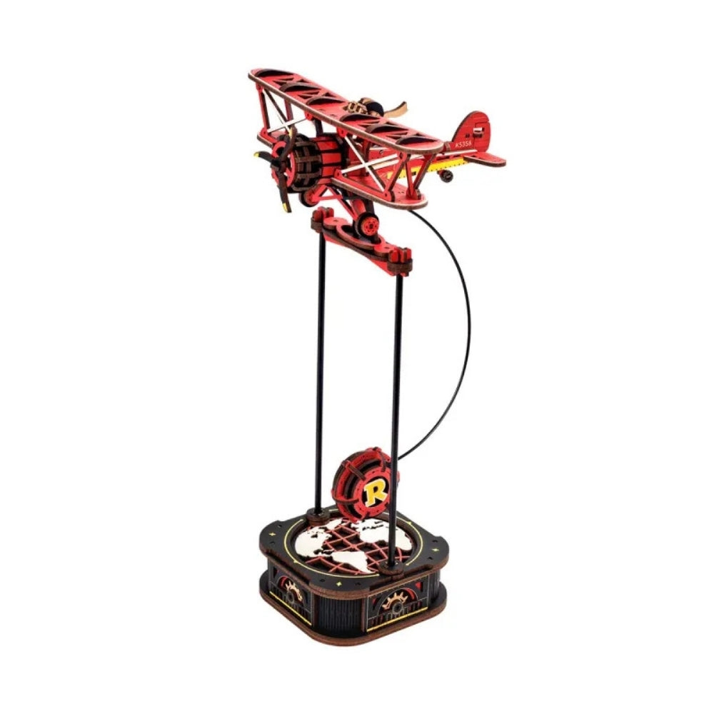 Red toy airplane model on a white background