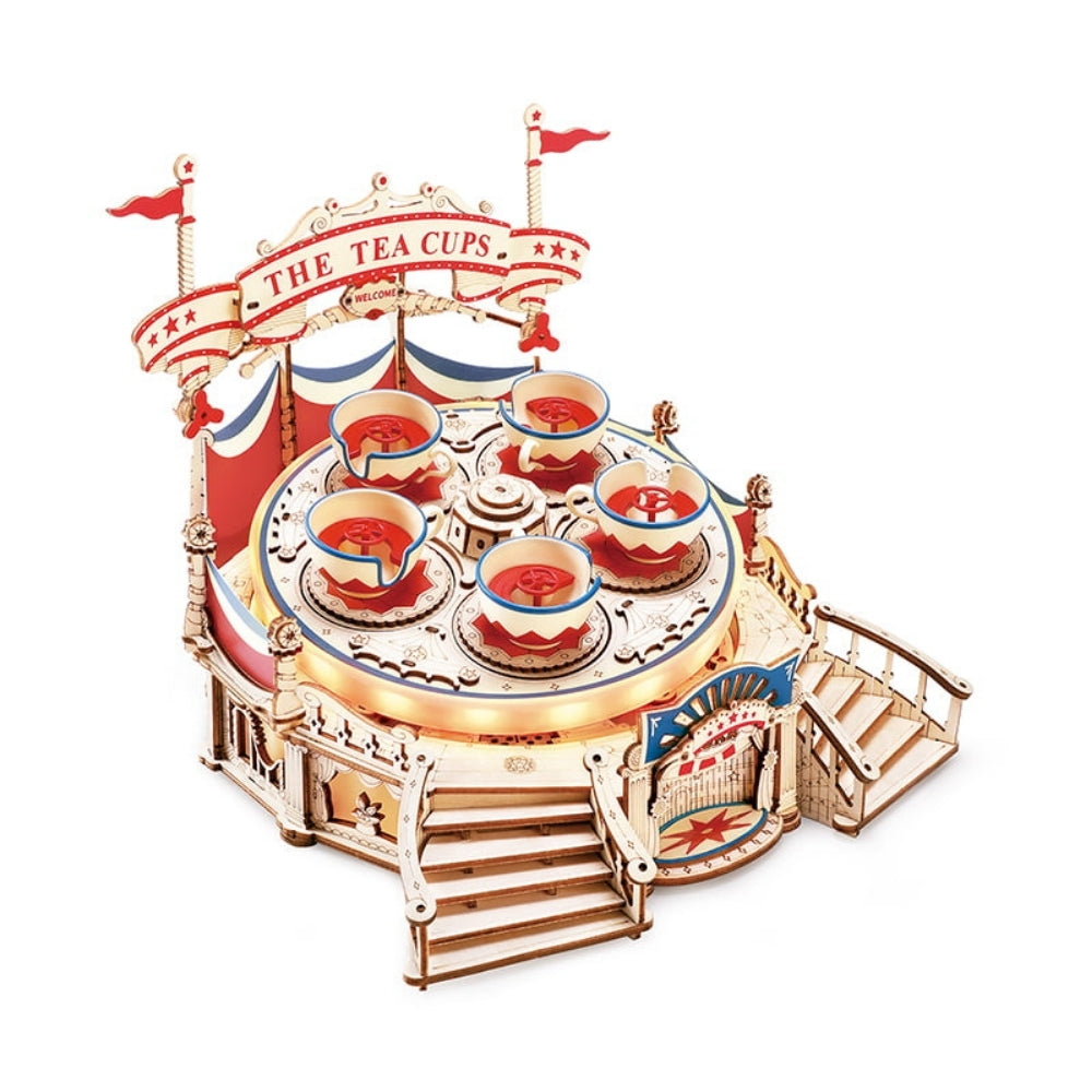 Wooden model of a tea cup carousel with red, white, and blue colors on a white background.