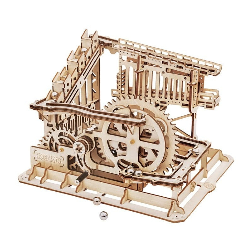 Wooden mechanical model kit with gears on a white background