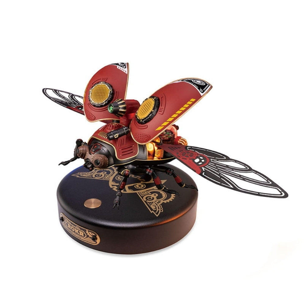Decorative beetle sculpture on a black base with intricate details