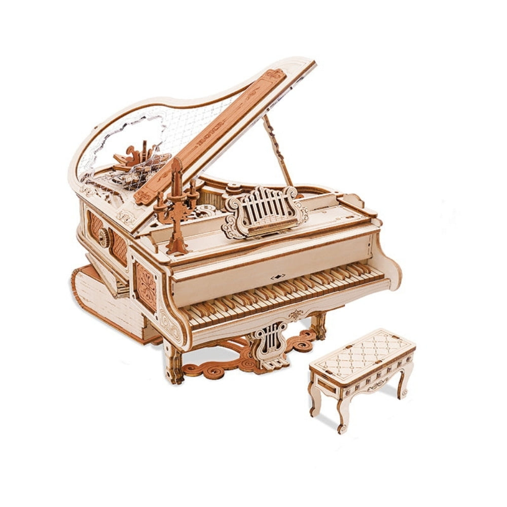 Wooden model of a grand piano with a bench on a white background