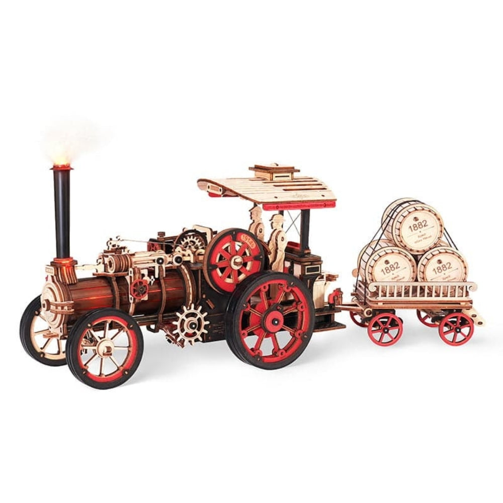 Wooden model of a steam engine with red wheels on a white background