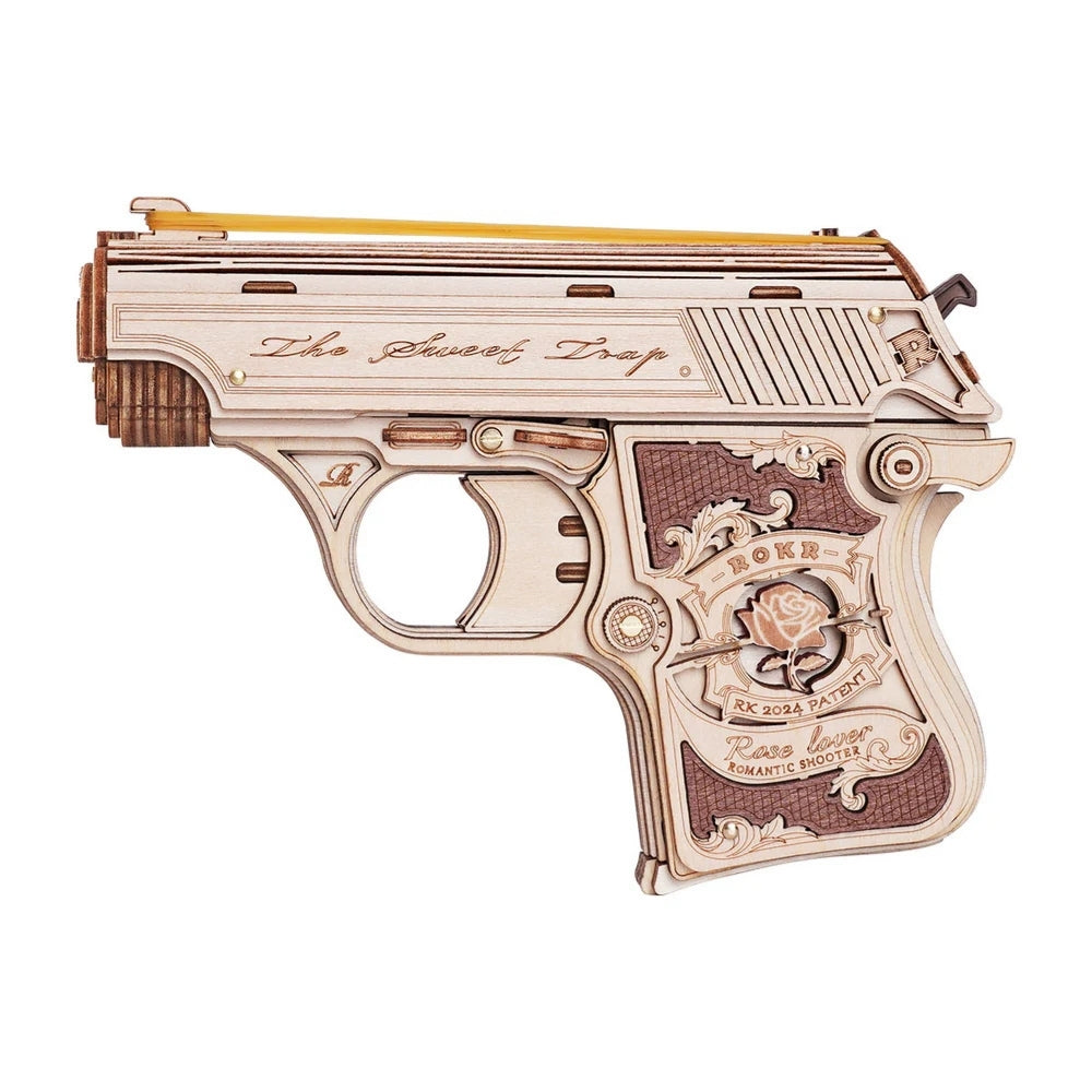 Decorative gun with intricate designs and text on a white background
