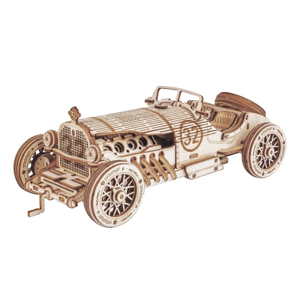 Wooden model of a vintage car on a white background