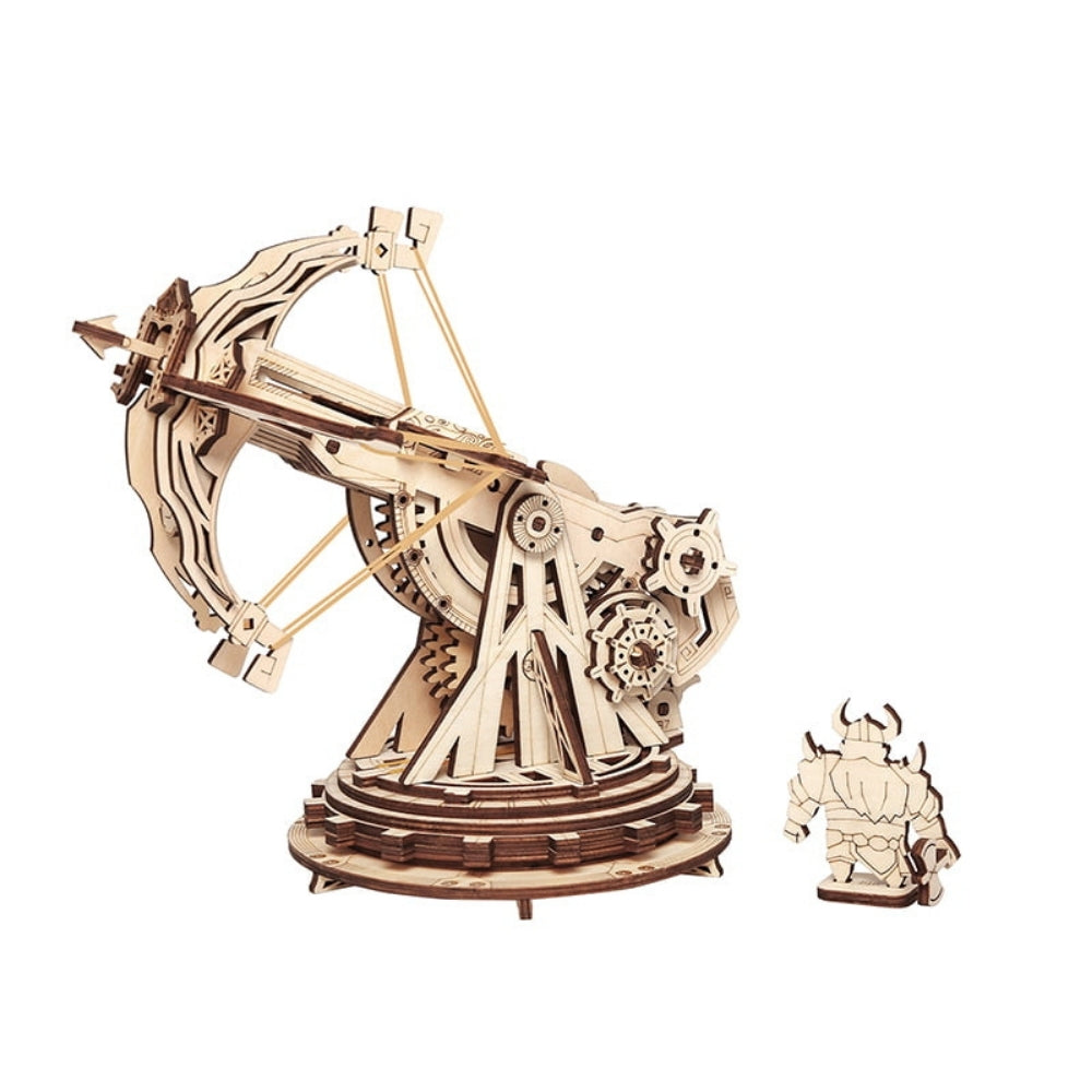 Wooden mechanical model kit on a white background