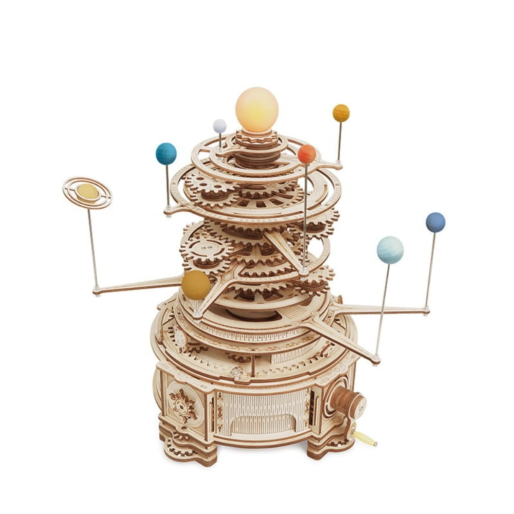 Wooden model of a solar system with planets on a white background