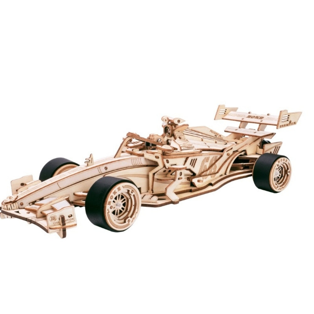 Wooden model of a Formula 1 car on a white background