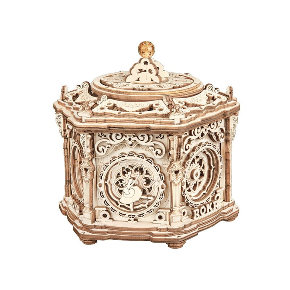 Decorative wooden box with intricate carvings on a white background
