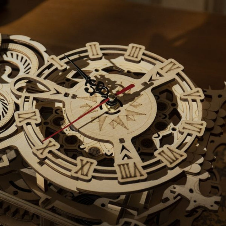 Wooden mechanical clock with intricate design on a wooden surface