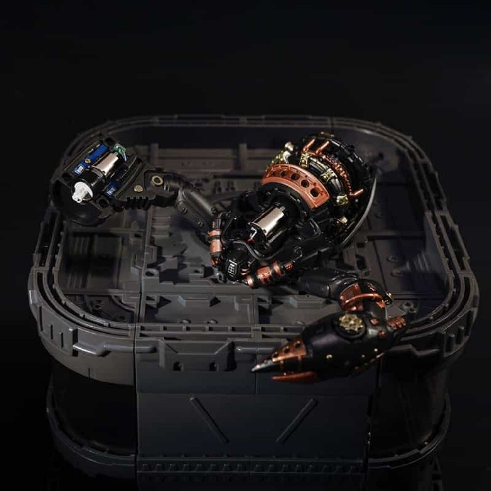 Technical components inside a black rectangular container on a dark background