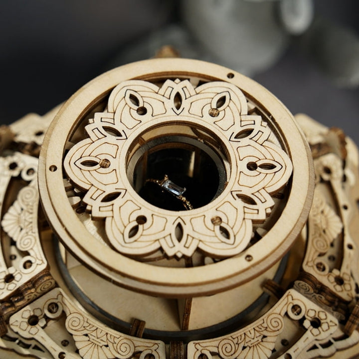 Close-up of a wooden mechanical model with intricate patterns