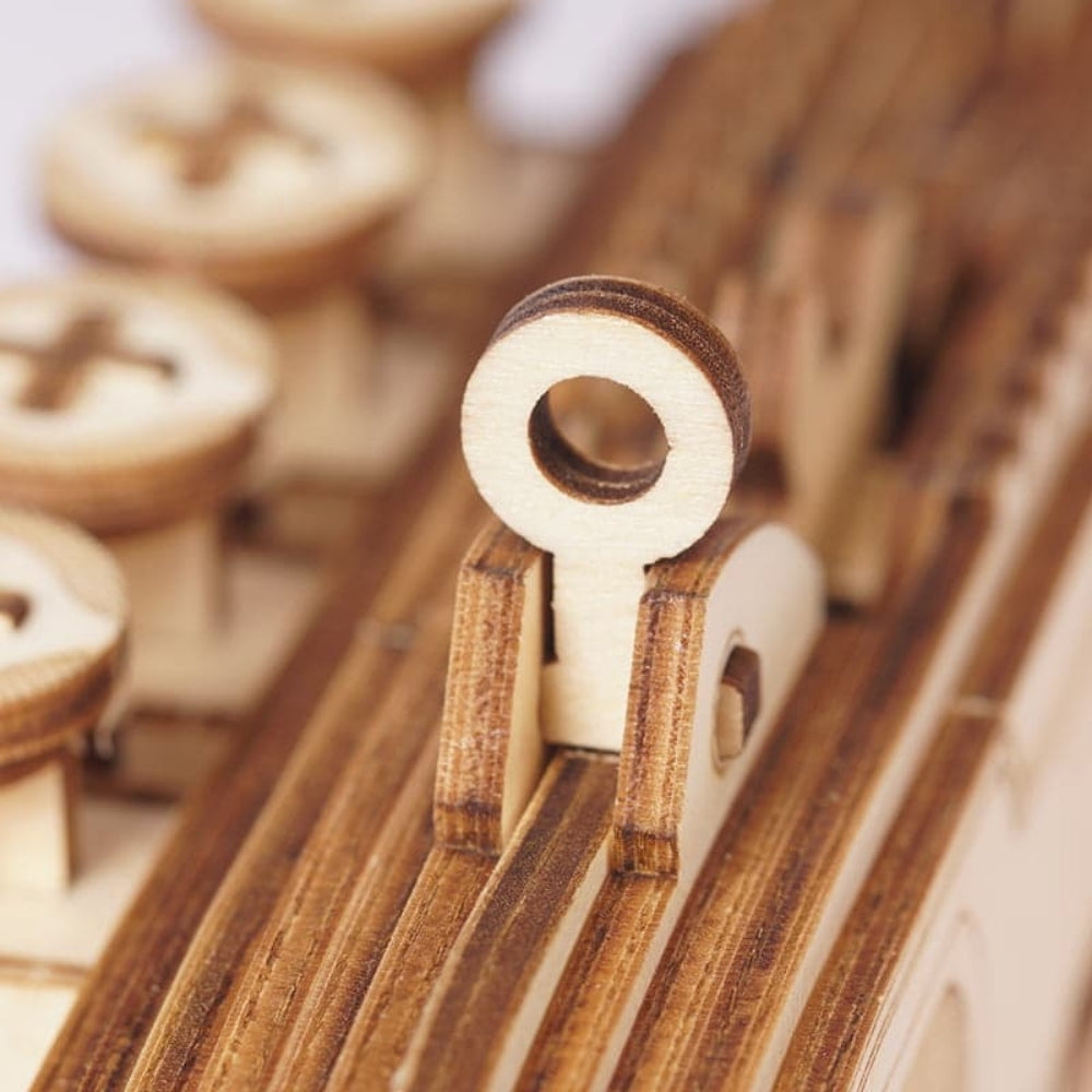 Wooden letter 'O' among other wooden letters on a blurred background