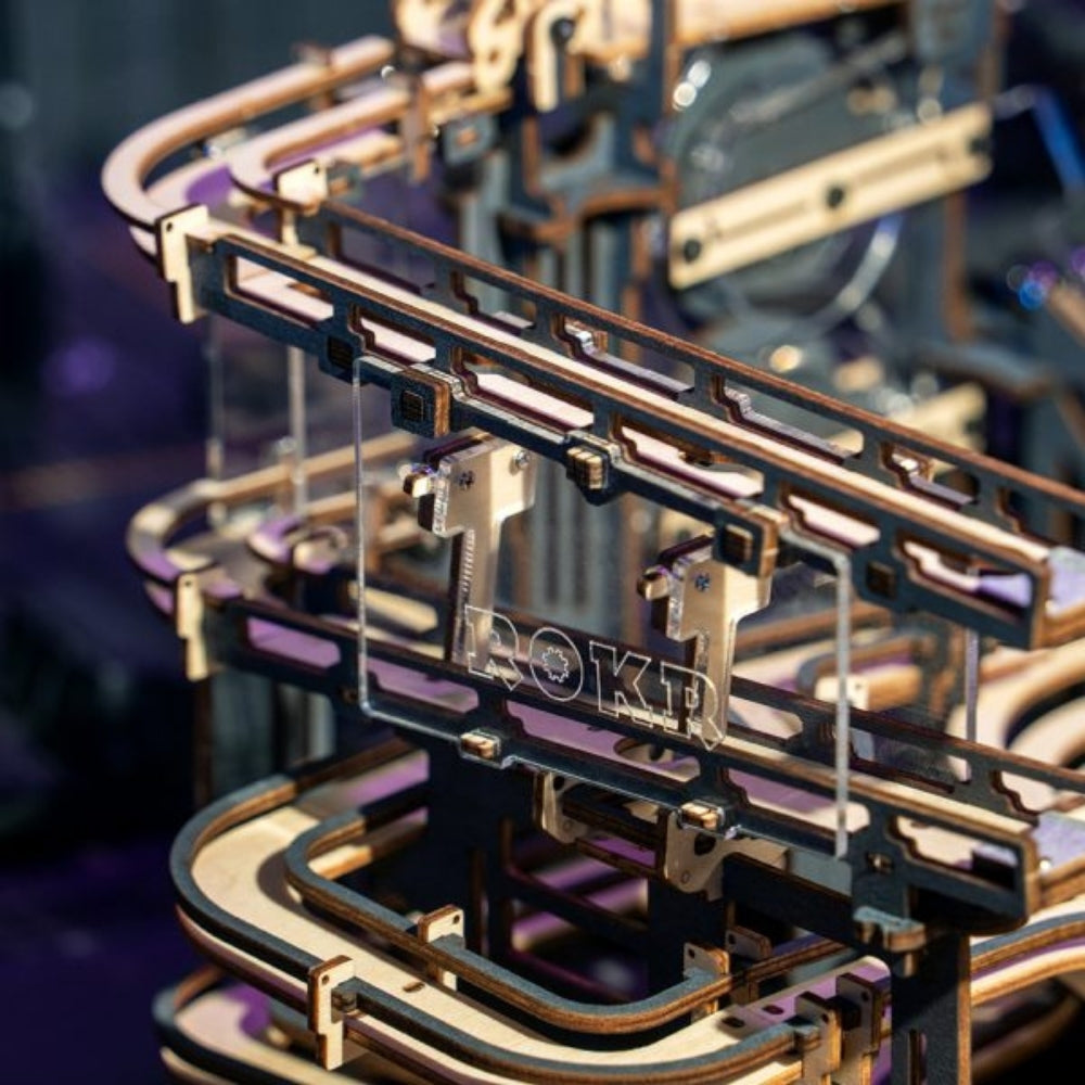 Close-up of a mechanical model with 'ROKR' branding on a blurred background