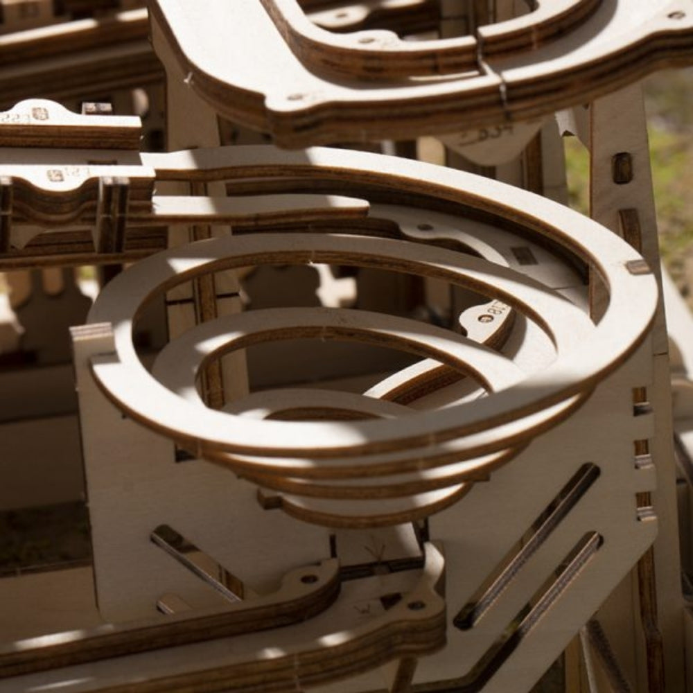 Close-up of a wooden mechanical model with interlocking parts