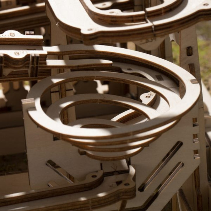 Close-up of a wooden mechanical model with interlocking parts